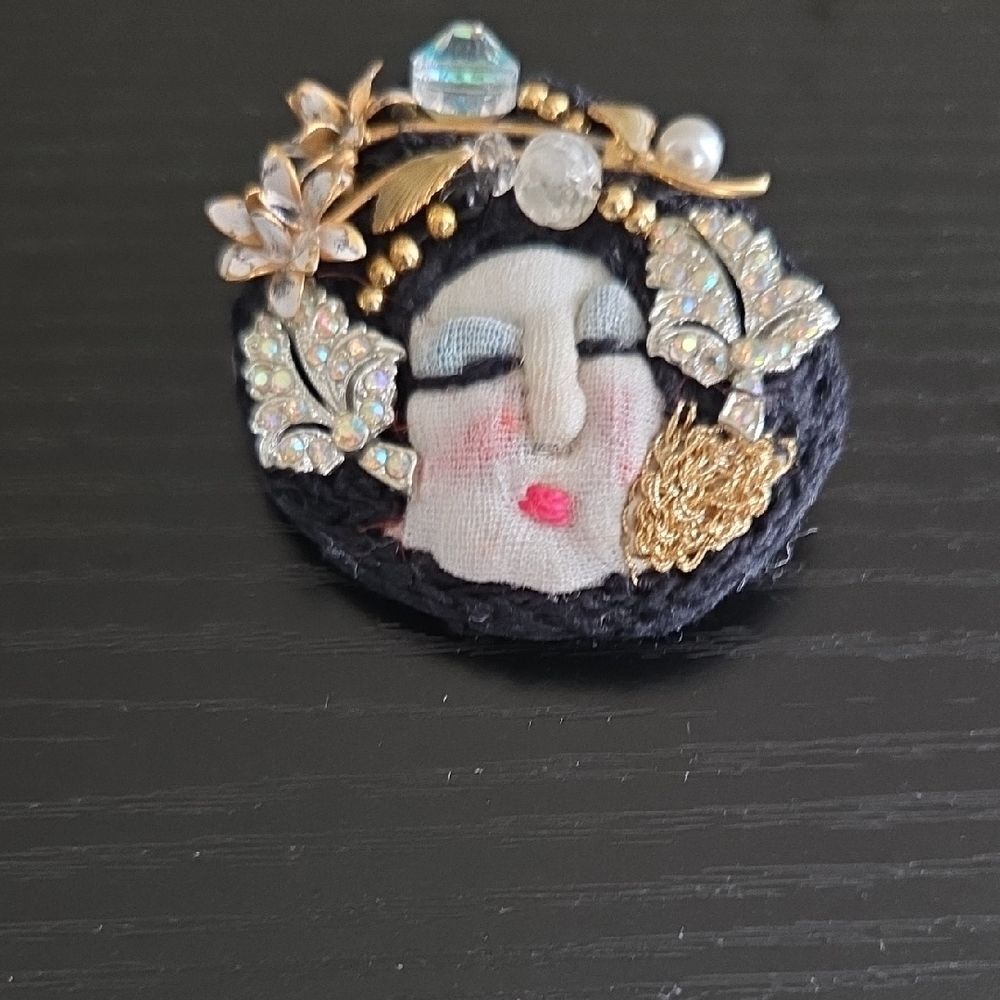 Artistic Face Brooch with Gold and Black Accents
